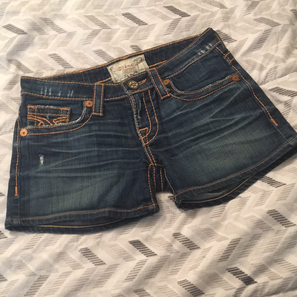 Big Star women’s dark denim blue Jean short accented with orange embroidery
